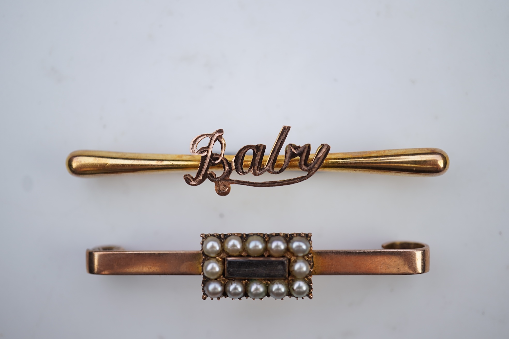 Two bar brooches